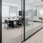 Fuzion's Vinyl plank flooring lining the conference room of a modern office.