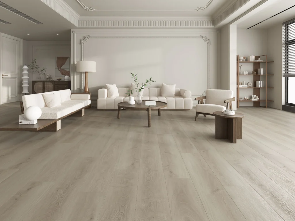 Spacious living room with hybrid-resilient-bg light wood flooring, white sofas, a round coffee table, modern chairs, and large windows streaming in natural light.