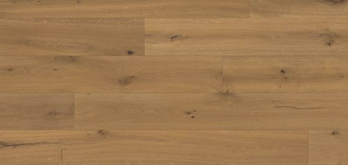 L’image présente un plancher en bois brun clair avec des motifs de fil et des nœuds visibles, composé de larges planches disposées horizontalement.
