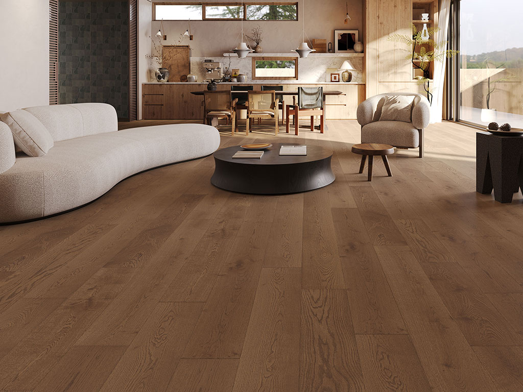 Coral-Haven-web features a modern living room with light wood floors, a curved white sofa, dark round coffee table, and an open kitchen-dining area. Sunlight pours in through large windows.